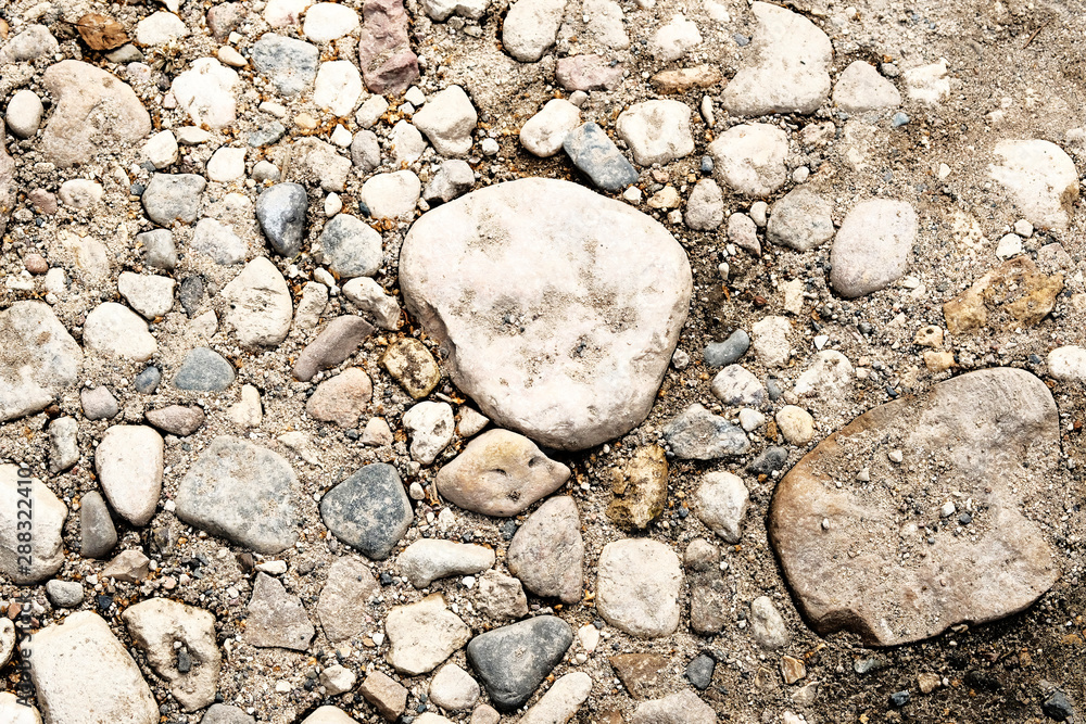Light stone background with different sizes of stones Light stone background with different sizes of stones