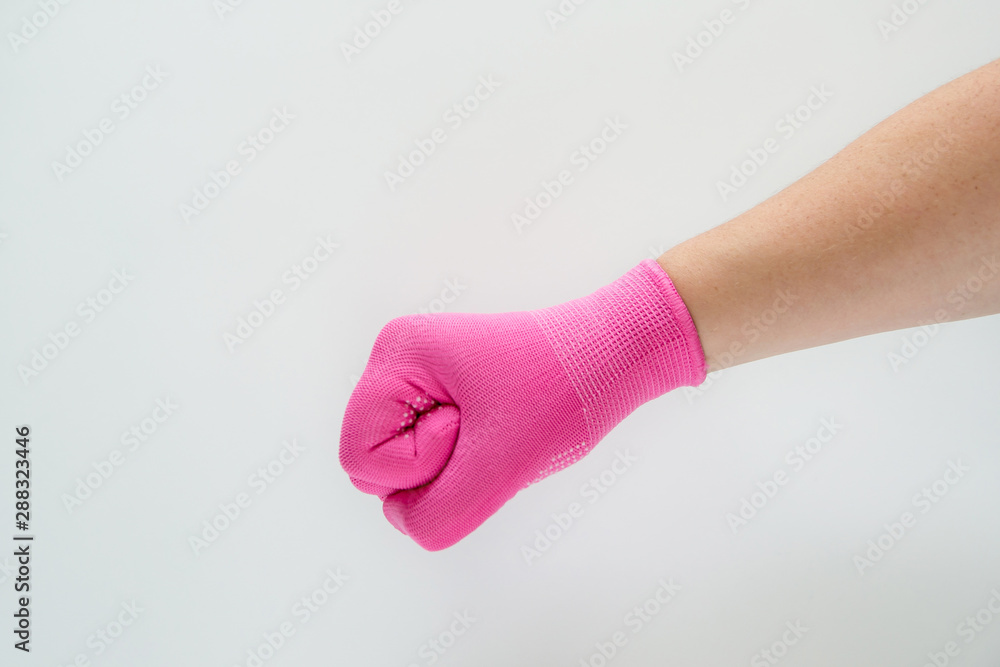 The hand in the pink nylon glove is clenched into a fist