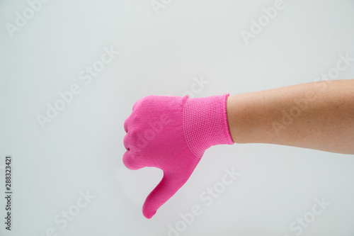 Hand in pink nylon gloves. Seen yet