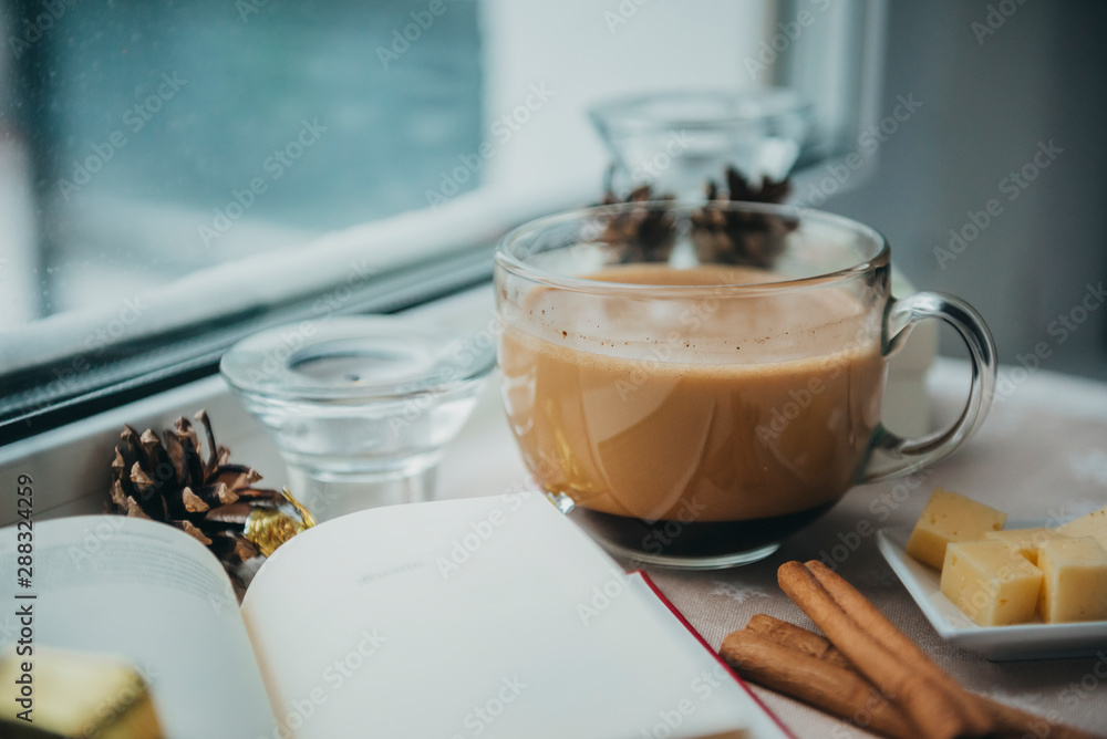 1 Cup of coffee with milk near the window, book, cinnamon, cheese, cone, candle, 1 Cup of coffee with milk near the window, book, cinnamon, cheese, cone, candle,