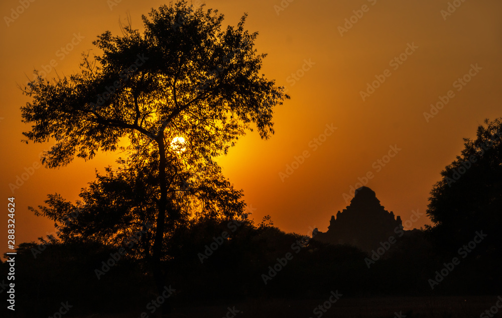 Outlines of an ancient buddhist temple in Bagan, Myanmar at sunset