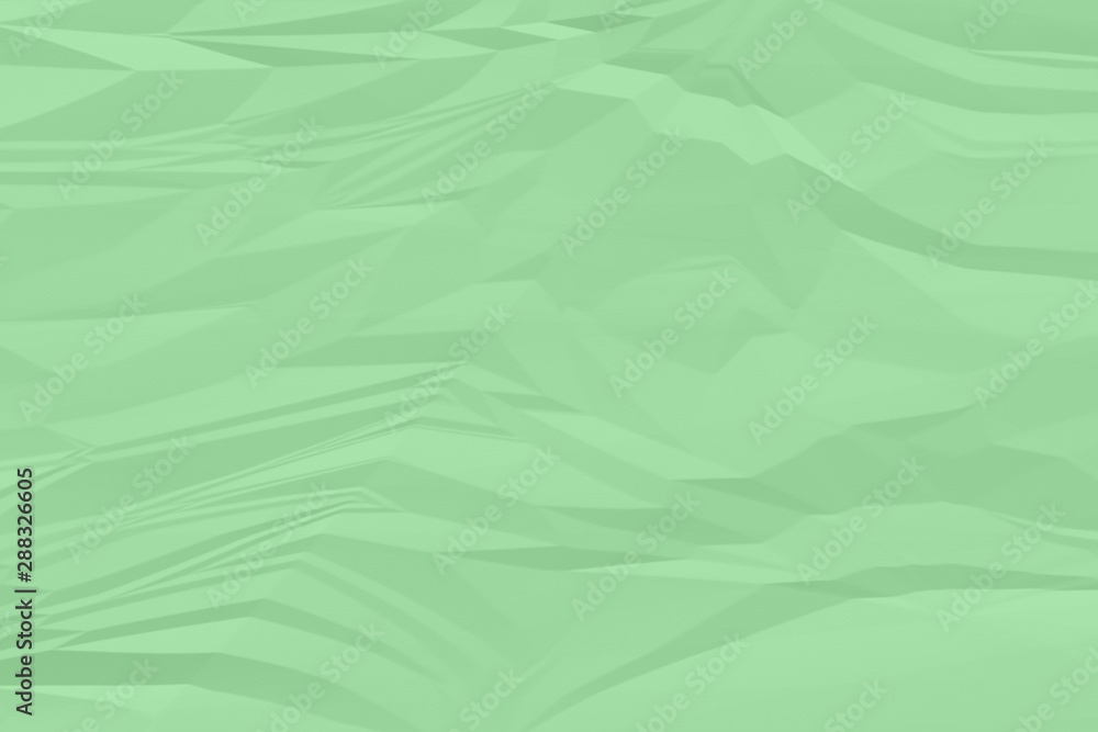 Fototapeta premium crumpled green paper background close up