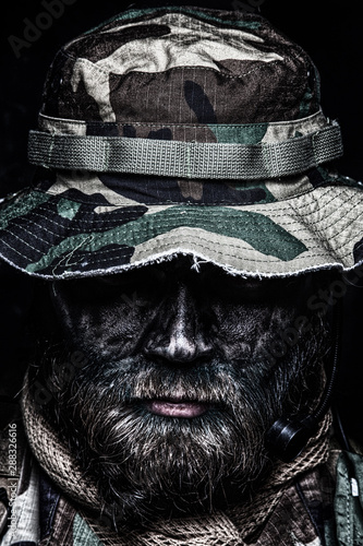 Commando soldier in boonie hat close up portrait photo