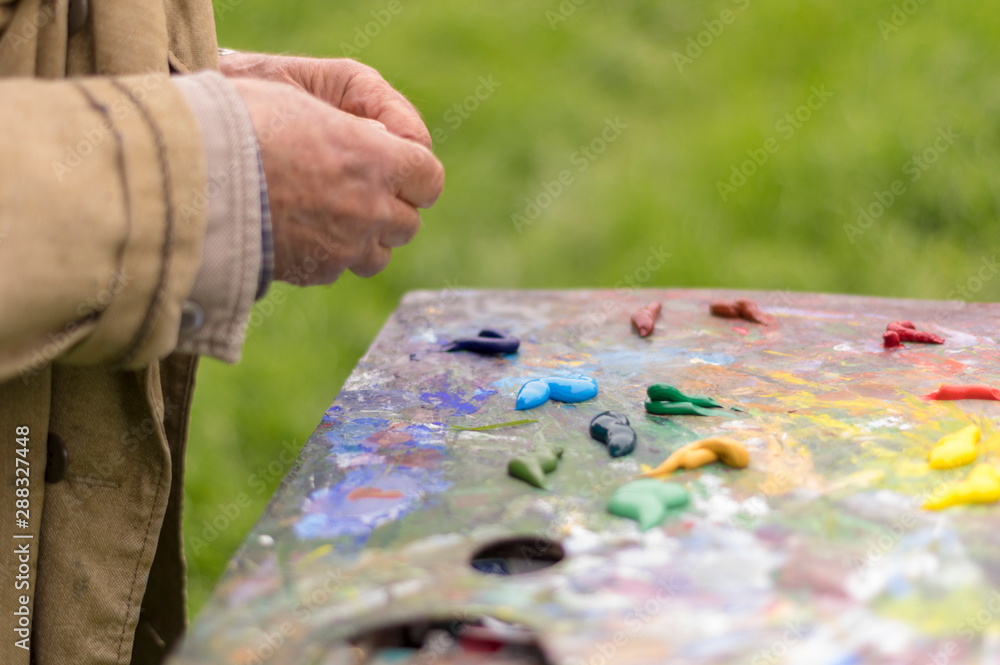 Drawing with oil paints on the nature. Wonderful hobby Drawing with oil paints on the nature. Wonderful hobby