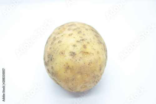 Ripe Potato Tuber located on a white background