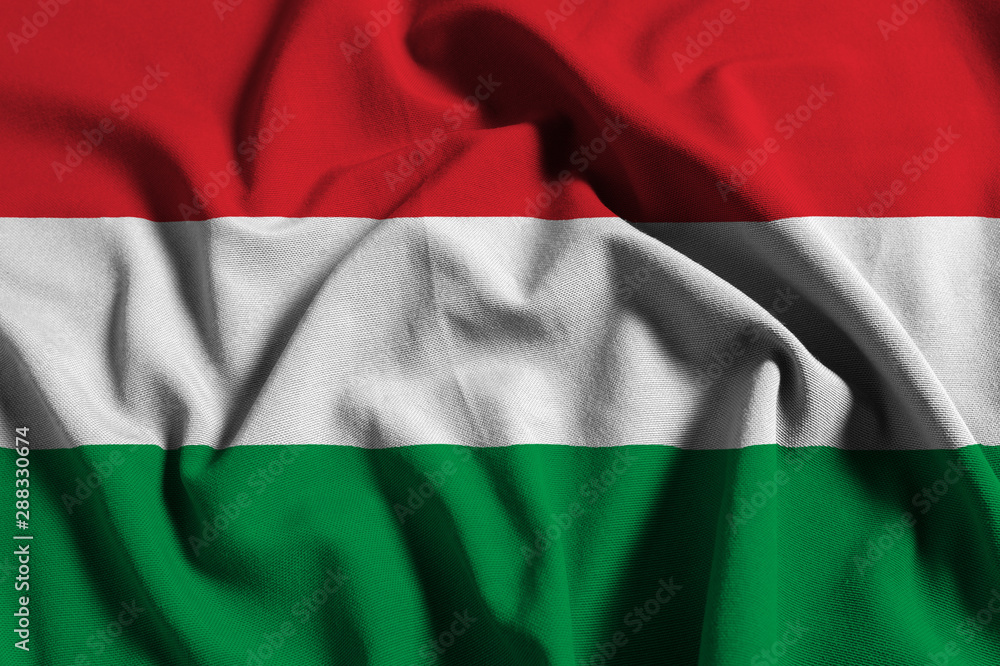 National flag of Hungary on a waving cotton texture background