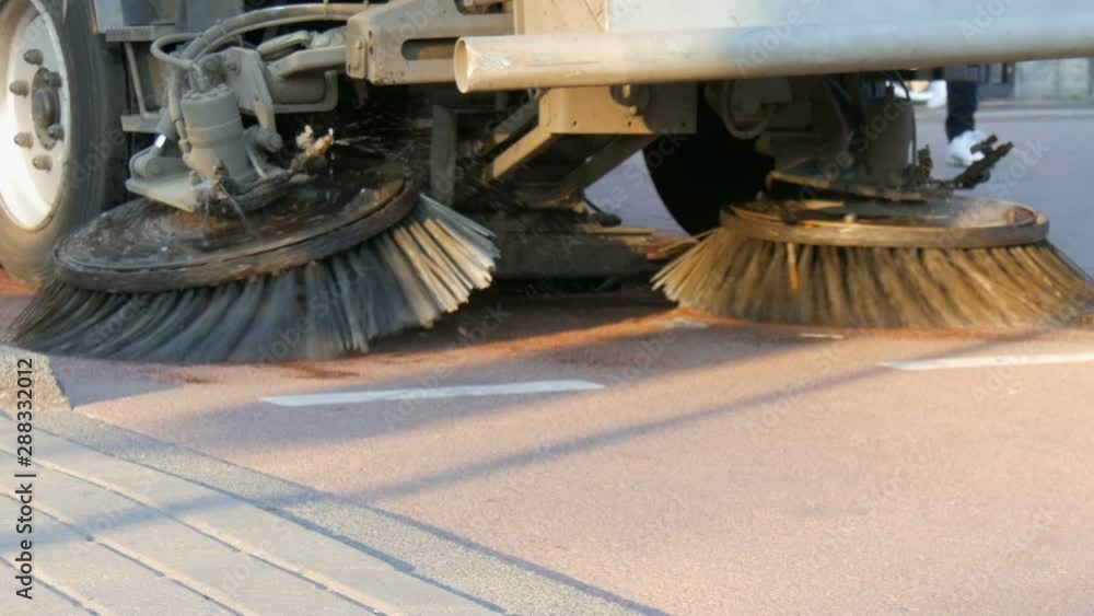 Amsterdam, The Netherlands - April 21, 2019: A special cleaning machine cleans the street garbage. City service. Street sweeping machine Amsterdam, The Netherlands - April 21, 2019: A special cleaning machine cleans the street garbage. City service. Street sweeping machine
