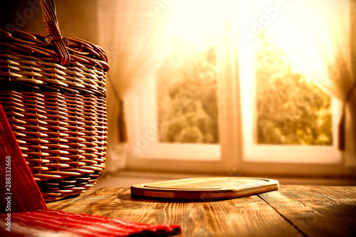 Autumn basket on desk and window backckground space  photo