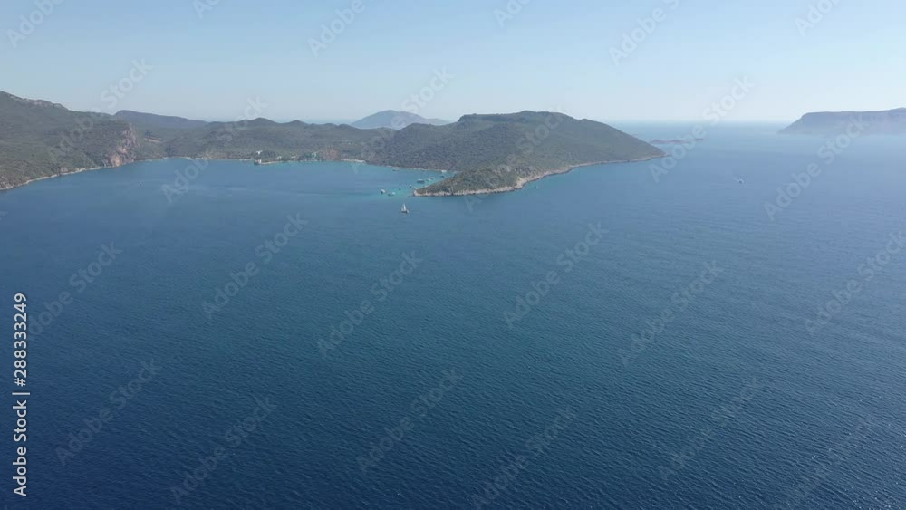 Drone moving towards to the sea aerial view of Kaş / Turkey Town and harbor with beauitful blue sea and sky 2 Drone moving towards to the sea aerial view of Kaş / Turkey Town and harbor with beauitful blue sea and sky 2