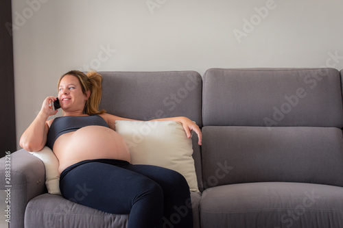 Young Pregnant Woman Speaking On The Phone