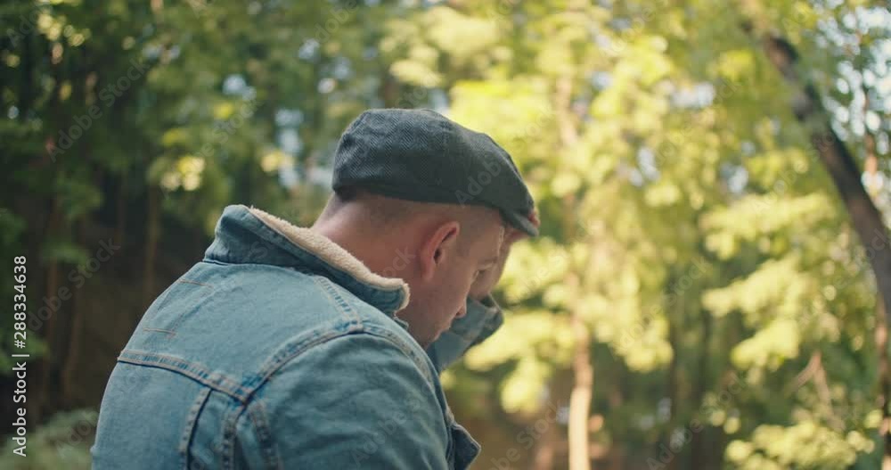 Man taking his hat , Camera behind of model Man taking his hat , Camera behind of model