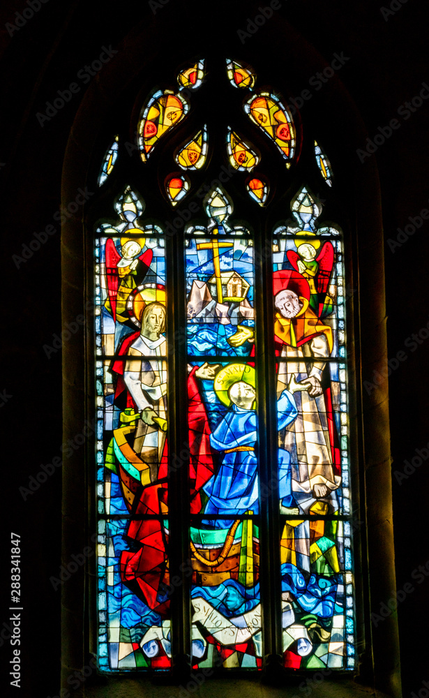 Saint-Malo, Brittany / France - 19 August 2019: detail view of stained glass windows in the cathedral of Saint Malo in Brittany in France