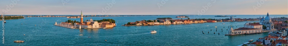 Aerial panorama of Venice lagoon with boats and San Giorgio di Maggiore church. Venice, Italy