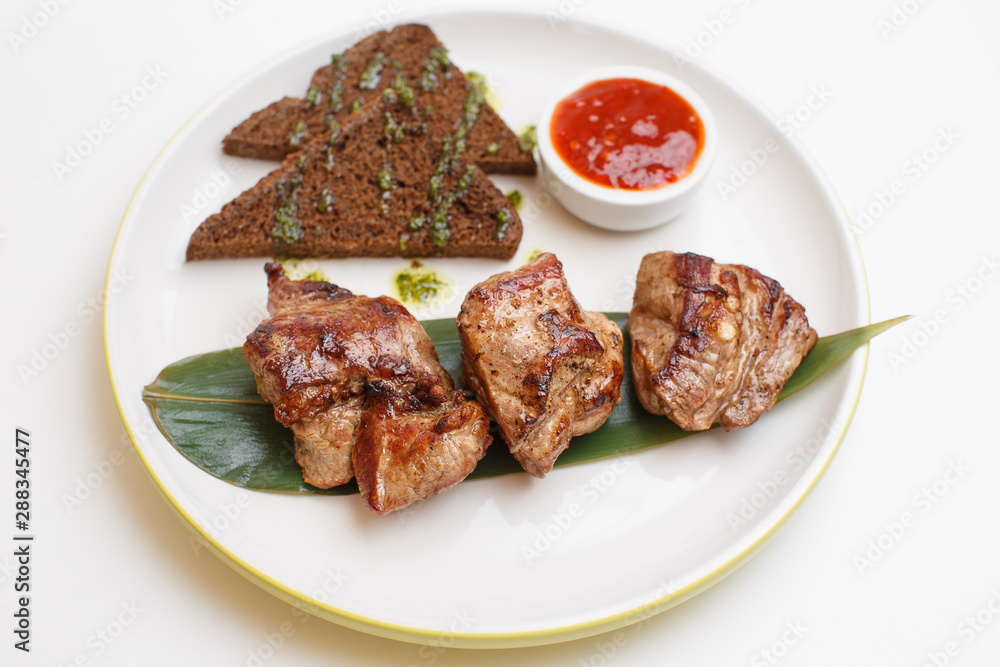 pork skewers on a stick on white background pork skewers on a stick on white background