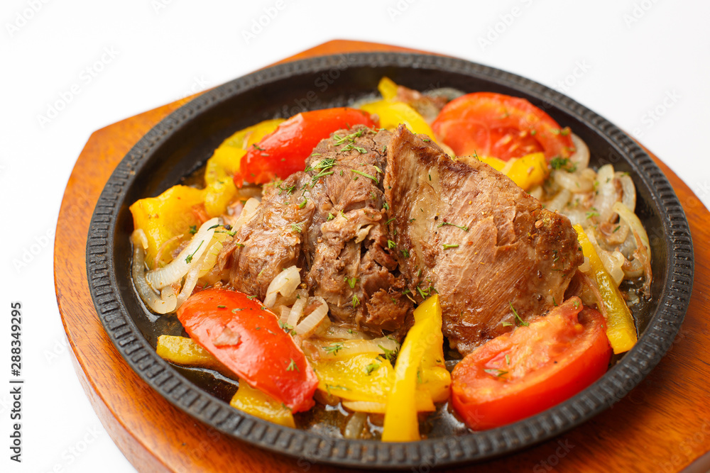 meat with vegetables on a white background meat with vegetables on a white background
