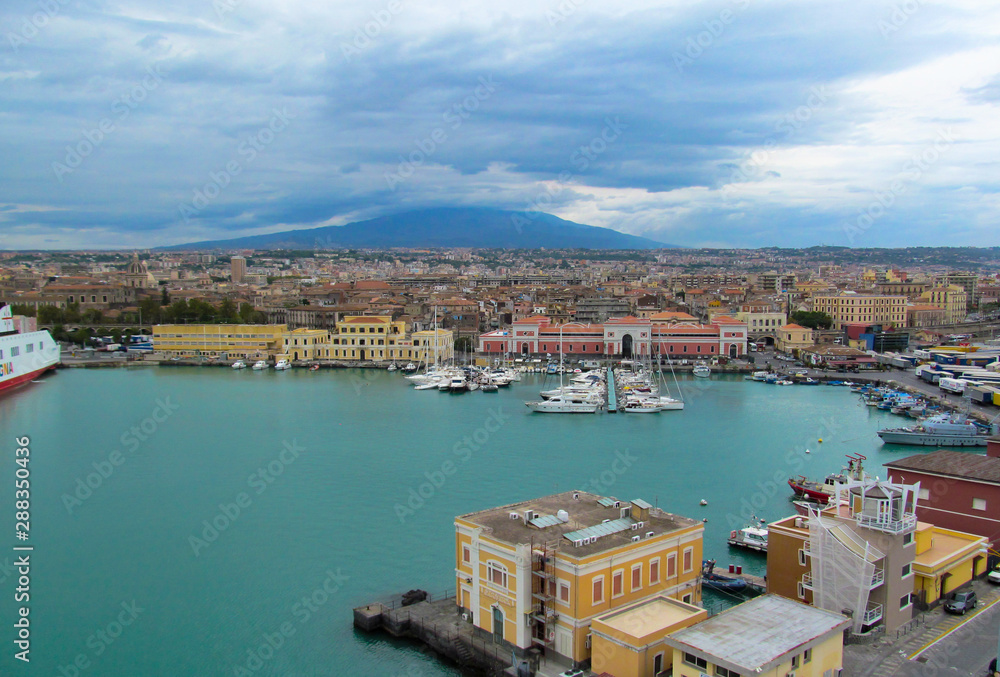 Harbor in Naples, Italy. View from the cruise ship to the port, yachts, city and Mount Vesuvius on a summer day.