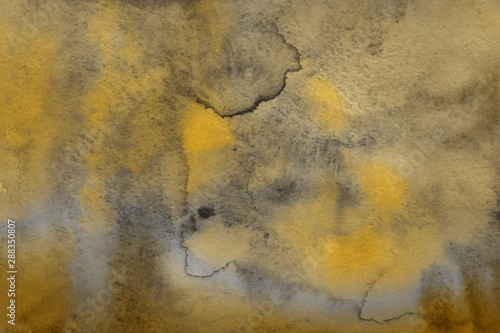 Yellow autumn watercolor texture with abstract washes and brush strokes on the white paper background. Chaotic abstract organic design.