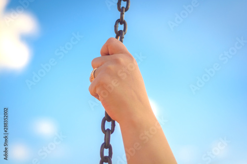 hand holding chain