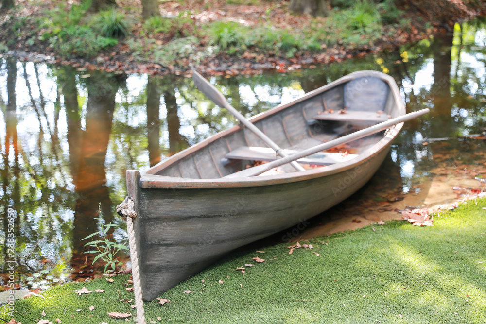 Lonely wooden old boat on the lake - Image Lonely wooden old boat on the lake - Image