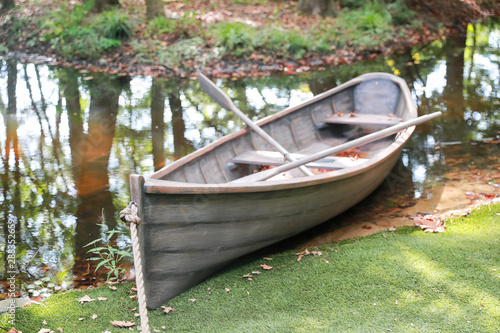 Lonely wooden old boat on the lake - Image