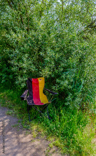 Empty Campingchair in the colours of the German flag