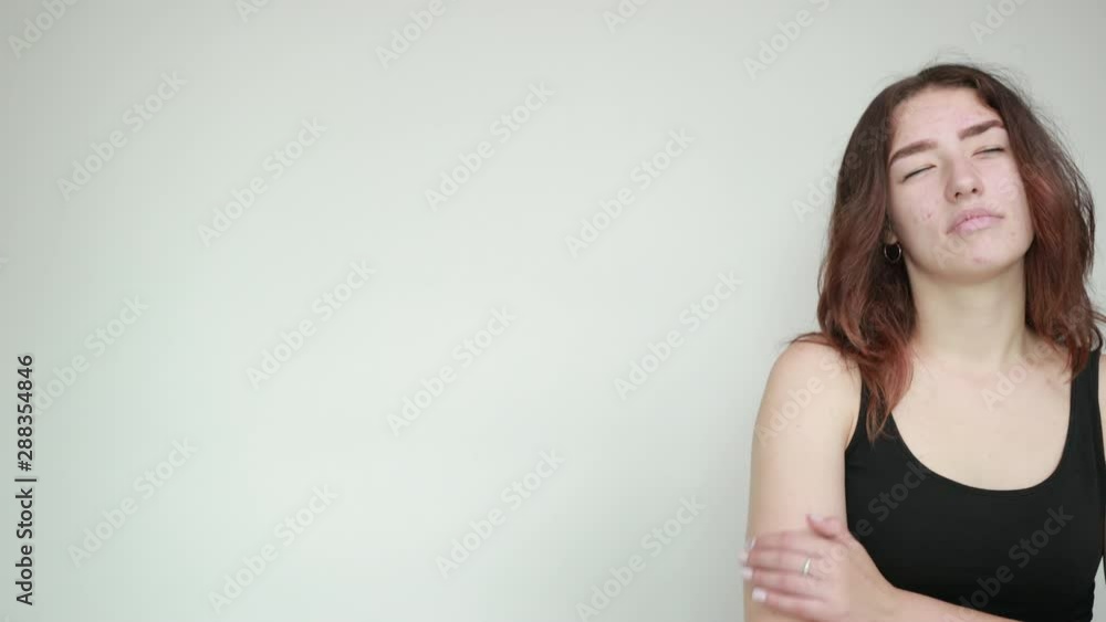 beautiful girl in black tank top over isolated white background shows emotions beautiful girl in black tank top over isolated white background shows emotions