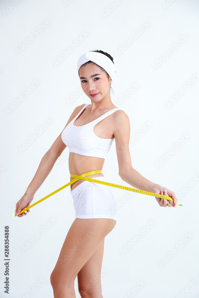 Slimming woman with beautiful body and measure tape Slimming woman with beautiful body and measure tape