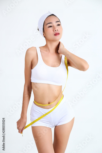 Slimming woman with beautiful body and measure tape © karnstocks