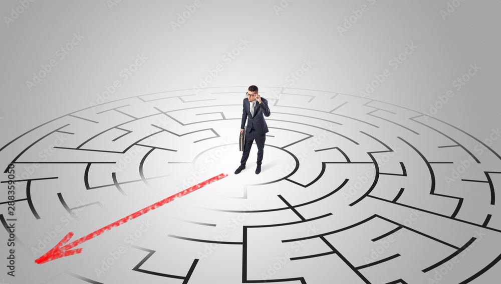 Businessman going through the maze with red arrow Businessman going through the maze with red arrow