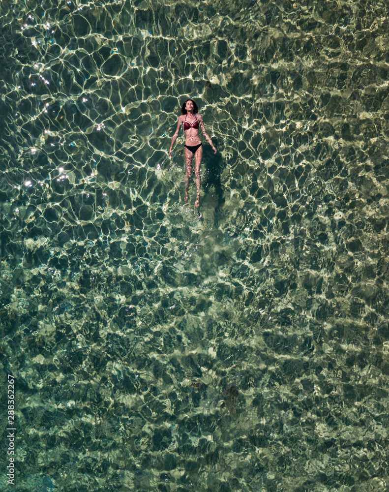Girl lying on the water