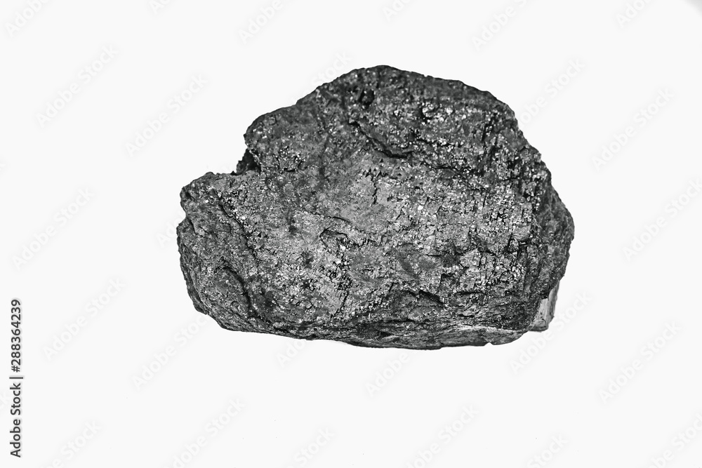 Pieces black coal lie on white isolated background, copy space