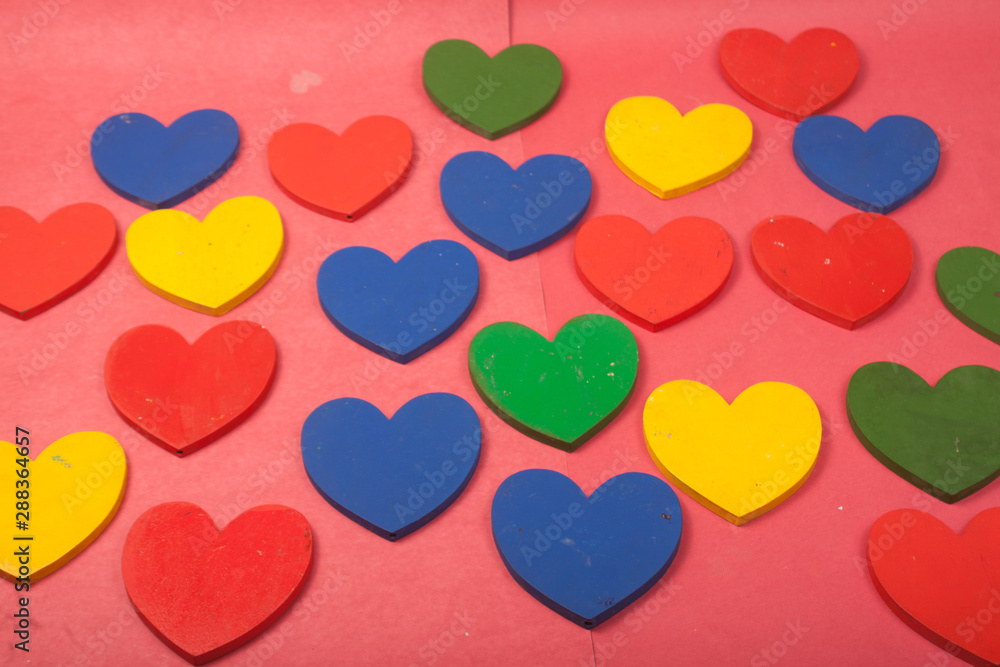 love colorful hearts on a red background