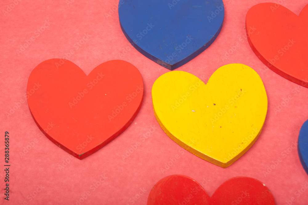 love colorful hearts on a red background