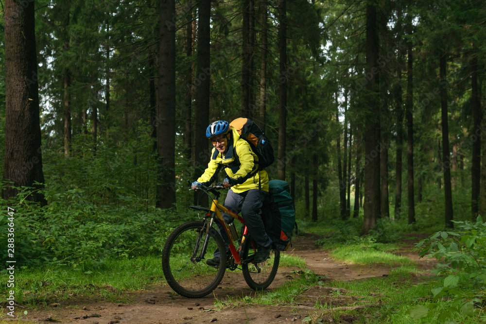 cyclist hiker in the autumn forest cyclist hiker in the autumn forest