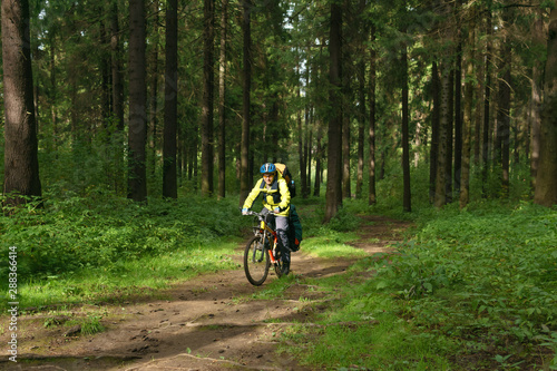 bicycle tourist in the autumn forest