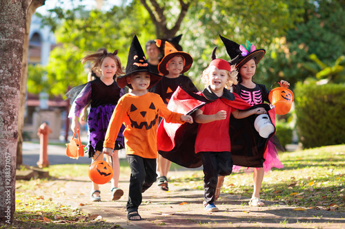 Kids trick or treat. Halloween fun for children. photo