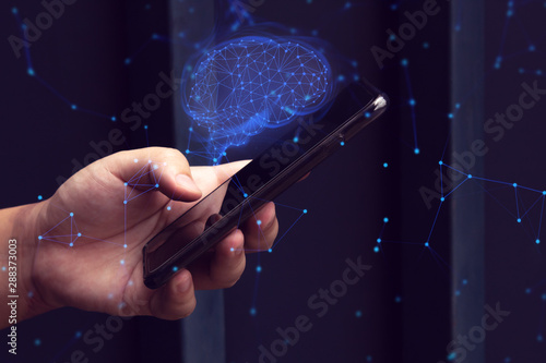 businessman hold and use smartphone for digital technology internet data social and network ai brain system concept