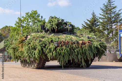 German army infantry fighting vehicle  drives on tactical exercise at military training area photo