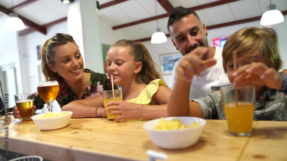 Family with children in a restaurant bar Family with children in a restaurant bar