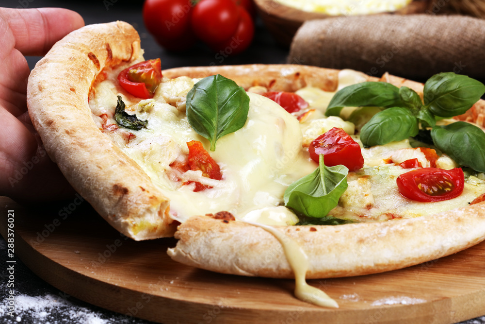 vegetarian italian Pizza with tomatoes, mozzarella cheese  and basil. Delicious italian pizza