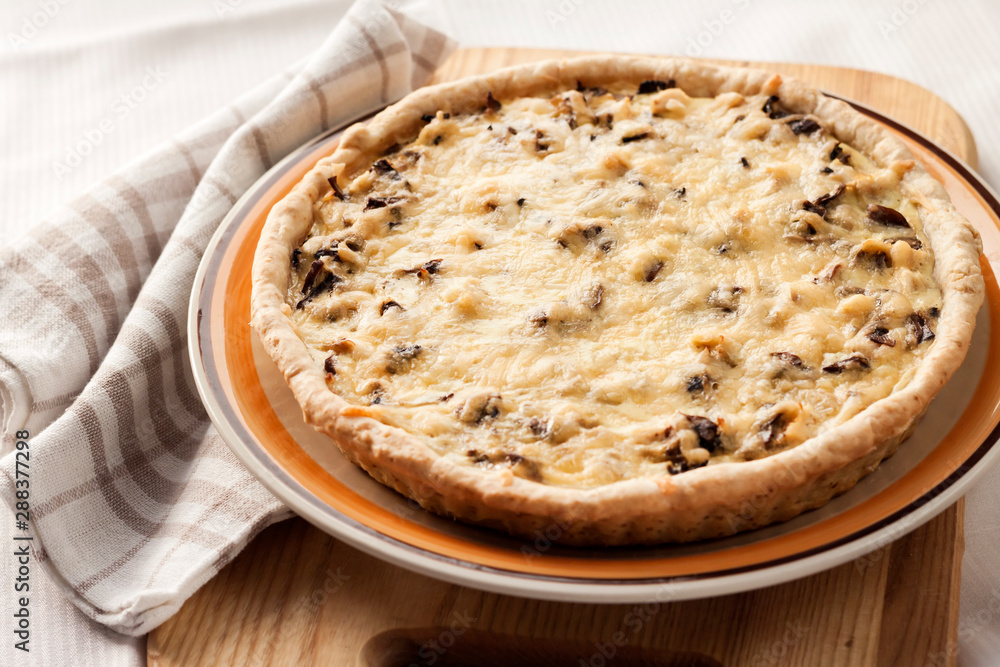Chicken tart with mushrooms and cheese on a plate Chicken tart with mushrooms and cheese on a plate