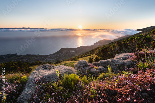 Sunrise landscape at the northeast coast of Pico Island, Ilha do Pico, with Sao Jorge Island in the background and the coastline with Prainha do Baixo,  Canto da Areia, Santo Amaro, and Terra alta.