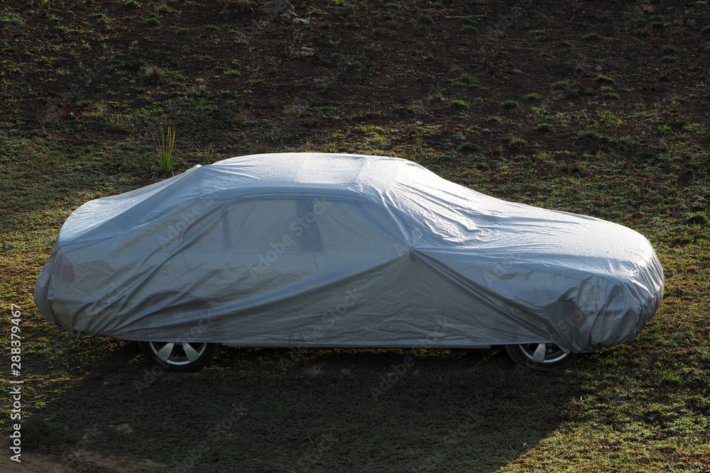 Car covered with a protective cover.