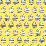 Seamless hand drawn pattern with cute  cartoon cupcakes in kids bright colors. Funny endless texture with doodle childs elements blue red green on yellow background