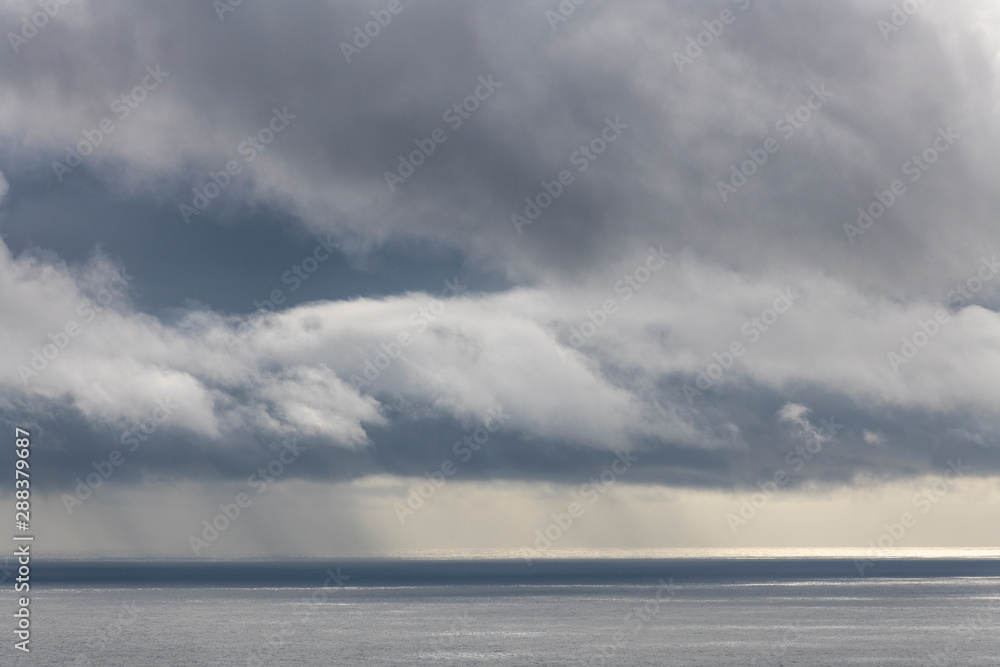 storm and rain clouds coming over the Atlantic Ocean near Faial Fayal Island in the Azores