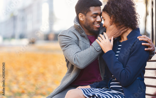 Romantic afro man telling his woman about his feelings