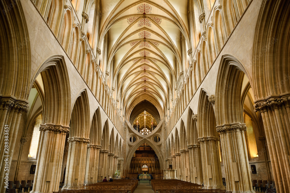 Interior of Wells Cathedral Anglican church from the nave showing St Andrews Cross arches at the sanctuary Wells England