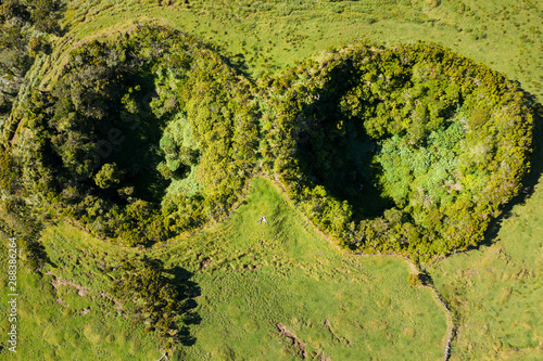 Quadro su tela Aerial image of typical green volcanic caldera crater landscape resembling 2 eye