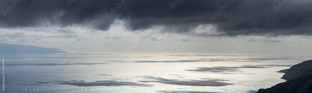 cloud shadows and sunlight reflections on the ocean water of the Pico-Sao Jorge channel, Azores cloud shadows and sunlight reflections on the ocean water of the Pico-Sao Jorge channel, Azores