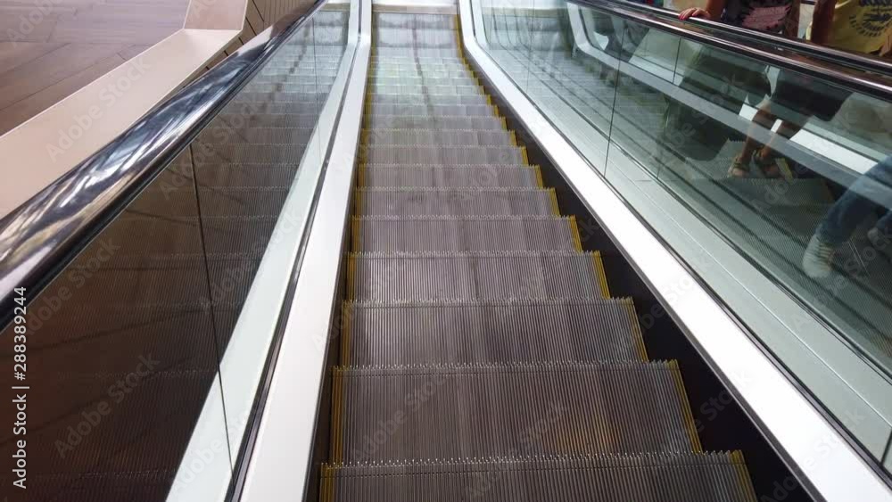 Modern escalator in shopping mall. Modern escalator in shopping mall.